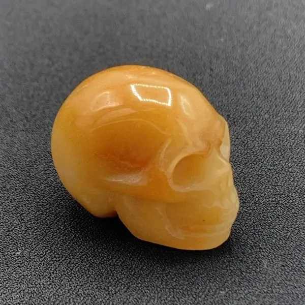 Crâne Miniature en Calcite Orange, profil 2 | Dans les Yeux de Gaia